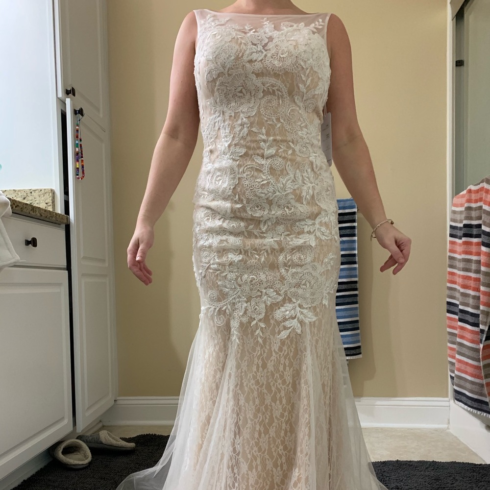 Brand new with tags attached wedding dress